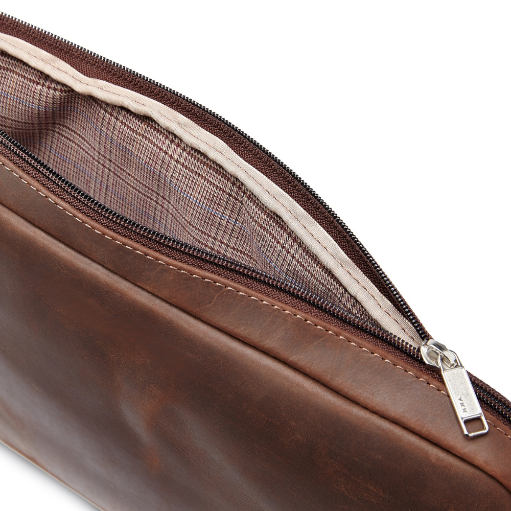 Simpatico eco conscious leather travel laptop case open to show fabric inside